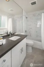 Gorgeous baths with stylish, full height 12x24 tiles, new toilet, vanity and sink, tile flooring