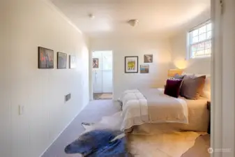 Two steps down from the kitchen you'll love this large primary bedroom.