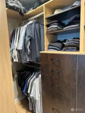 Large chest of drawers in the center, and two hanging spaces.