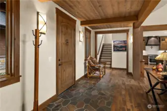 Entry hallway with stone. Photo from previous listing