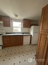 Kitchen with dishwasher, range, fridge