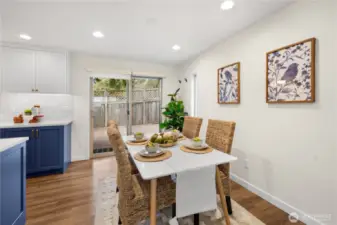 The dining room can comfortably accommodate a 6 top table.  The slider leads to the private back yard with huge deck and patio.