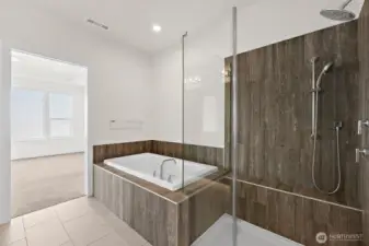 .A luxurious primary bath really adds to the experience of this home. A perfect place to unwind.