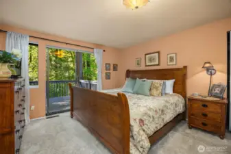Primary bedroom with sliding door to private deck