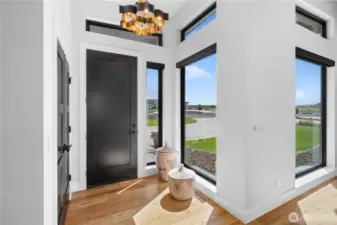 Front entry. Home features Motorized Hunter Douglas Designer PowerView Screen Blinds throughout.