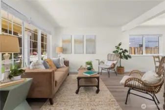 Living room off the front door has plenty of light and a cozy feel.