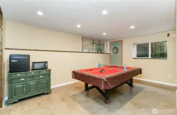 Lower level family room- table does not convey.