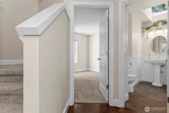 Straight ahead as you enter is the office / den and half bath