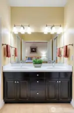 Dual vanity with newer counterops and updates.