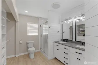 Primary on-suite with big double closet and shelving. Custom Shower and double sinks, with towel warming rack