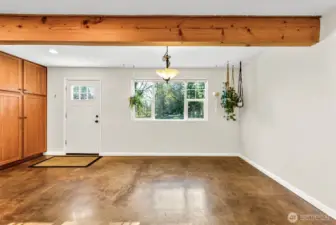 Kitchen has gorgeous wood beams and plenty of space for dining.