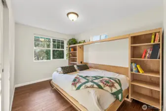 Bedroom 1 with a custom built-in murphy bed that conveys.