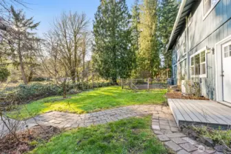 Backyard has easy access to the garden for fresh herbs and veggies.