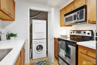 In-unit laundry is tucked in the kitchen closet.