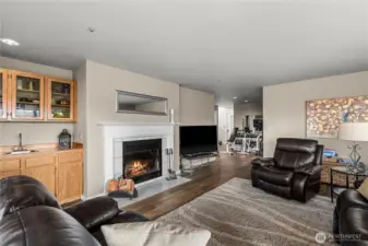 Family room with wood burning fireplace and wet bar.