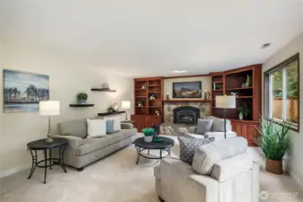 Fabulous family room features gas fireplace, and built-in cabinets.