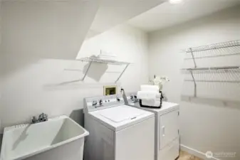 Laundry room with sink and hanging racks.  Washer and Dryer are included!
