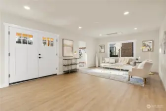 Large great room view of this complete remodel ready for new owners.  It has modern colors ,white painted millwork,Luxury Vinyl flooring throughout,recessed lighting and much more next