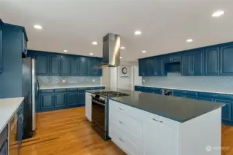 Newly remodeled kitchen with custom painted cabinetry, updated countertops and gas stove!