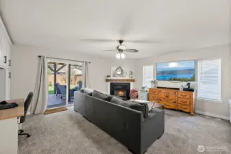Lower level family room with built-ins, fireplace, half bath and laundry room