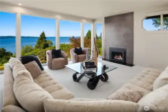 The formal living room is a great place to relax in front of the cozy fireplace