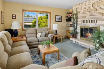 Beautiful rock fireplace located in the living room.