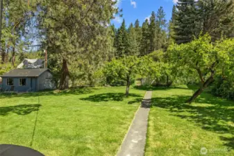 Pathway thru the backyard leads to the one car garage and alley behind the home.