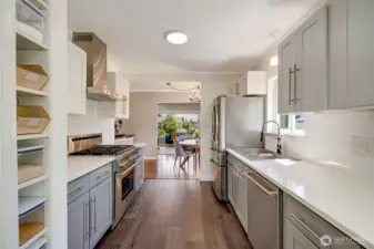 Main Level Kitchen Showcasing High-end Appliances. (Bosch Dishwasher and 1 year young Refrigerator)