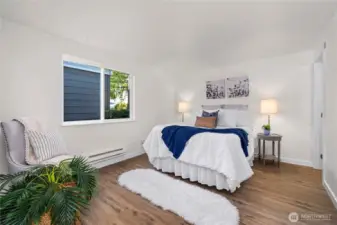 The Primary bedroom is a actually a suite, complete with 3/4 bath, workspace and HUGE walk-in closet.