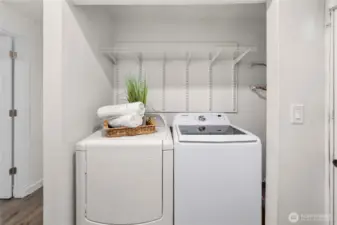 Full sized laundry appliances, water heater spot. Great front bench + charging station spot directly across.