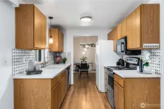 Kitchen flows from dining to second living area.