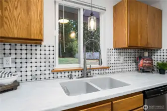 Sink looks out to spacious backyard!