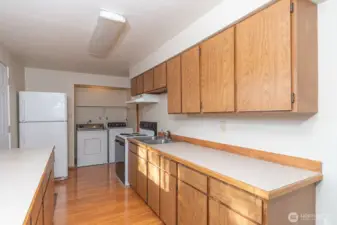 Downstairs apartment kitchen with washer and dryer