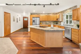 The island cooktop makes this kitchen a natural gathering spot for conversation.