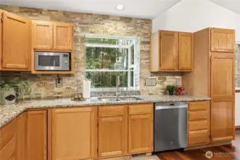 Enjoy calming green views through the garden window perfectly placed above the sink.