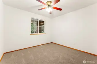 One of two generously sized extra bedrooms.