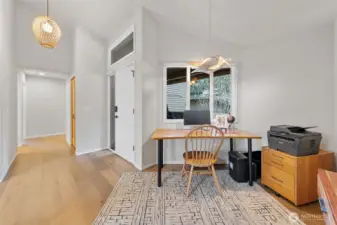 View from the kitchen looking toward the office nook, front entry and hallway to the bedrooms.