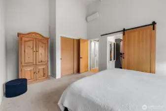 A second handcrafted sliding door that leads to the walk-in closet and bath.