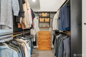 Walk-in closet with custom designed closet.