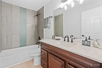 Main Floor Full Bath w/Custom Tile Shower Surround and New Vanity, Lighting, Fixtures. Stunning!