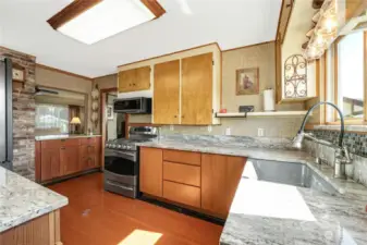 This entertainment style kitchen opens to the living space as well as to the formal dining room.