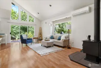 Before we head upstairs - notice the sliding door to the deck and how inviting this living room feels!