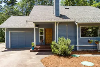 One Car garage has a work bench and room for shelves lots of storage or a car! Let's head inside!