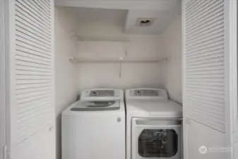 The laundry room has a full size washer/dryer that remain with the home.  There is additional storage space.