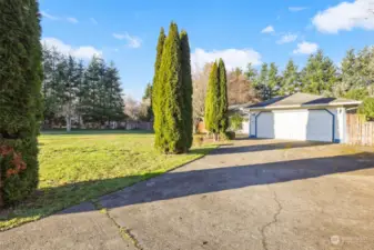 Entrance from circular driveway to 2 car garage and home