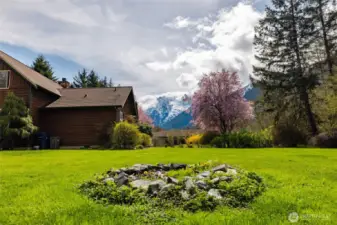 Fire pit in back yard with the beautiful Mountain View.
