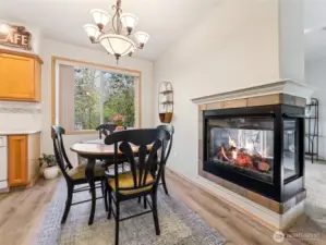 Ample dining space cozies up to the 3-sided gas fireplace!