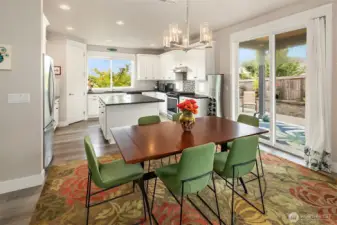 The slider off the kitchen and dining area leads to a private, landscaped patio oasis that seamlessly extends the living space on mild days.