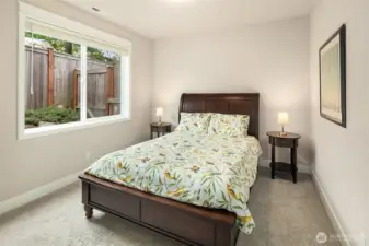 This main floor bedroom has en suite access to a full bath. It makes a great guest room tucked privately away from the 4 upper floor bedrooms or you could utilize it for multi-generational living.