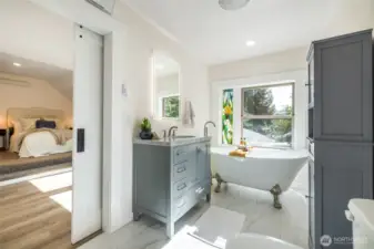 Good sized primary bathroom with all new plumbing fixtures and lighted mirror.